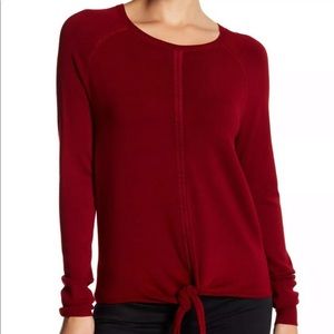 Red sweater knit top with tie detail in the front
